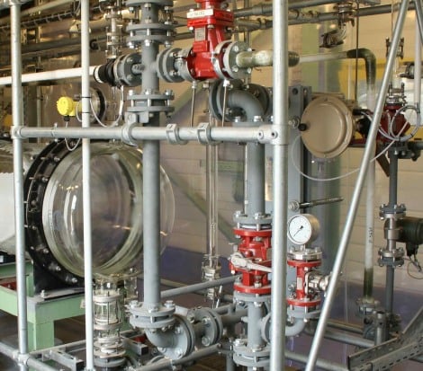Vacuum generation with corrosive liquid condensate